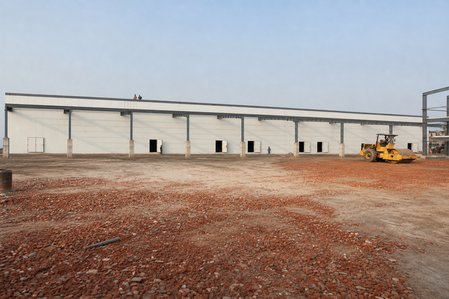 Cold store panel installation with roller compactor